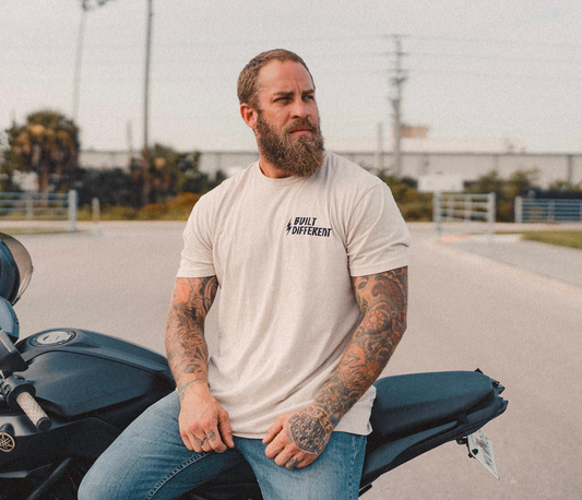 We Defy The Norm - Built Different Tee
