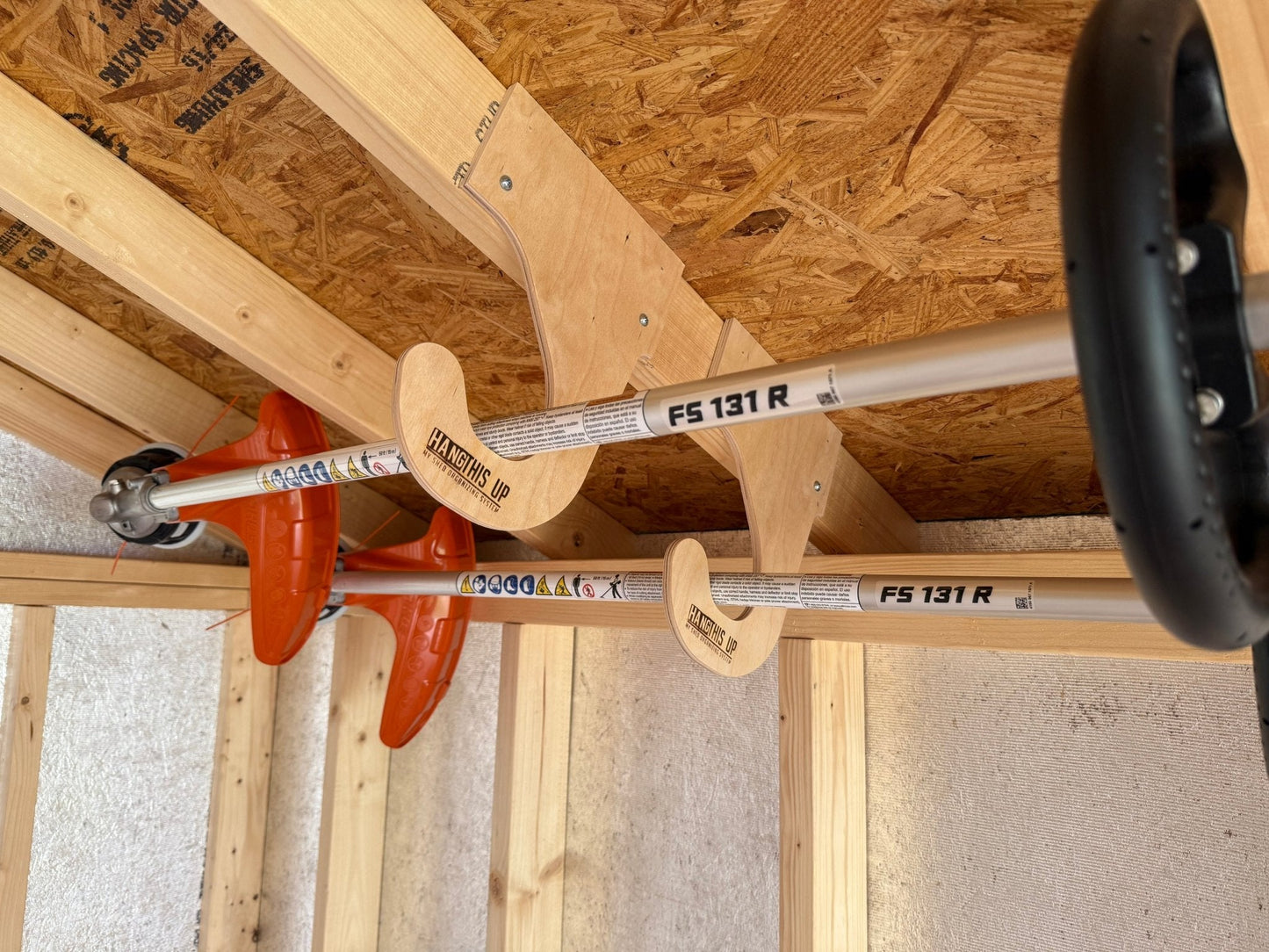 HangThis Up - Ceiling Weed Wacker Organizer, hangs from ceiling rafters in shed, easy to install, fits all weed wackers