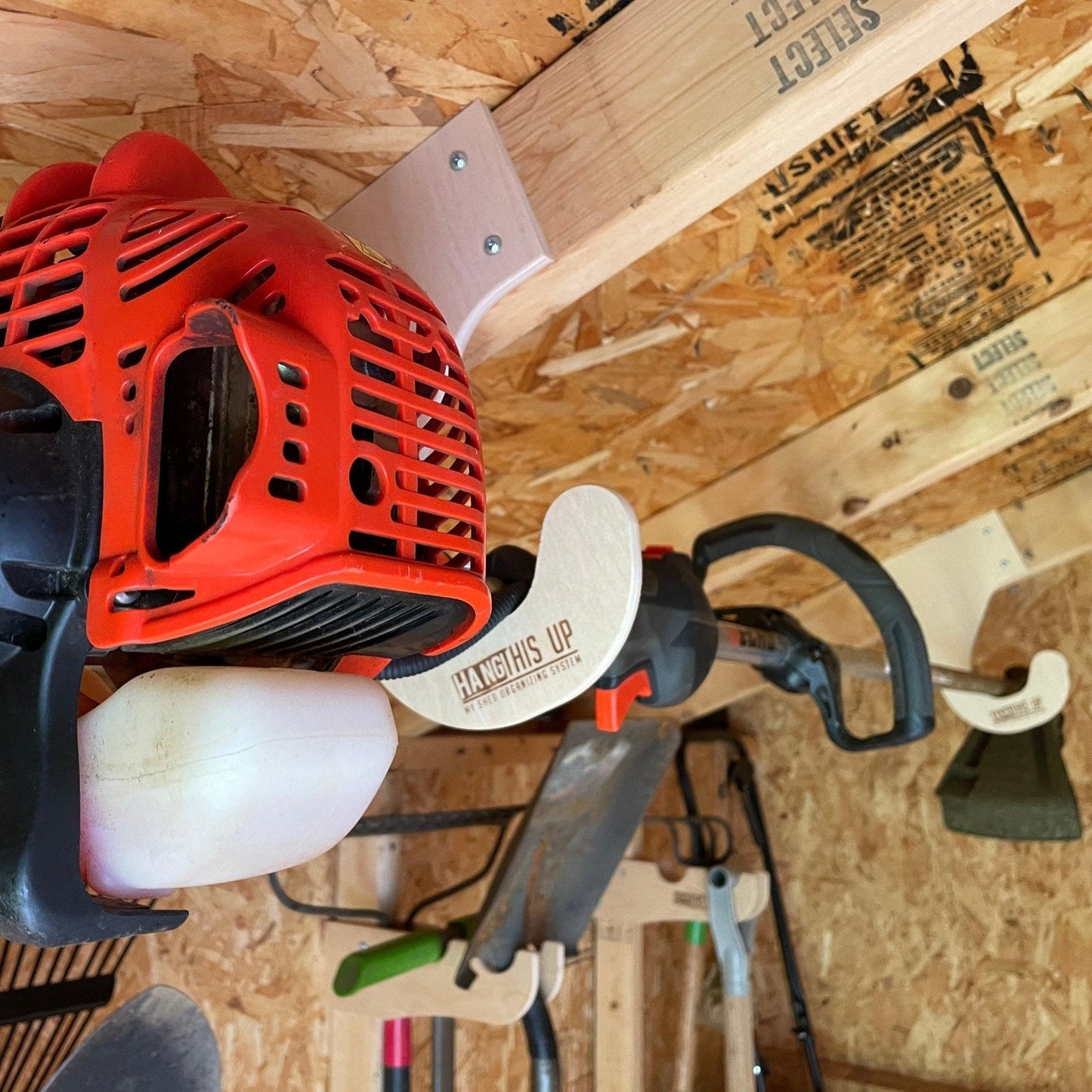 HangThis Up - Ceiling Weed Wacker Organizer, hangs from ceiling rafters in shed, easy to install, fits all weed wackers